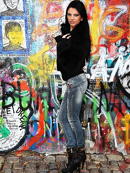 Brunette teen undresses in the public toilet