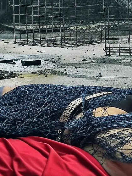 Black Superhero captured in netting. KO and fondle