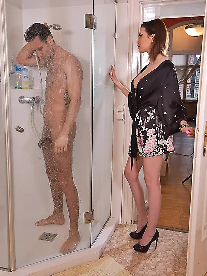 Young woman wore sexy robe and joined man in the shower giving a
