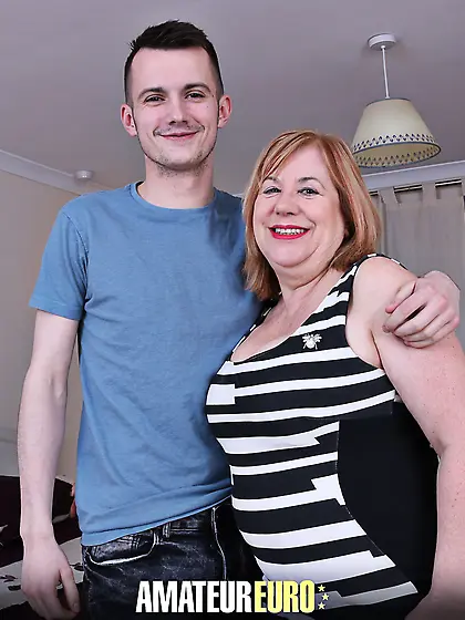 Sexy big tits grandma loves to play with the penis of a man