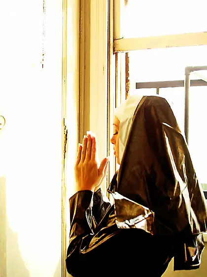 Tawny Roberts drops down her nun outfit and fucks her pussy with