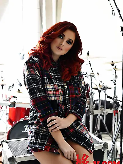 Beautiful redhead chick Lucy Vixen is turning here and there sho