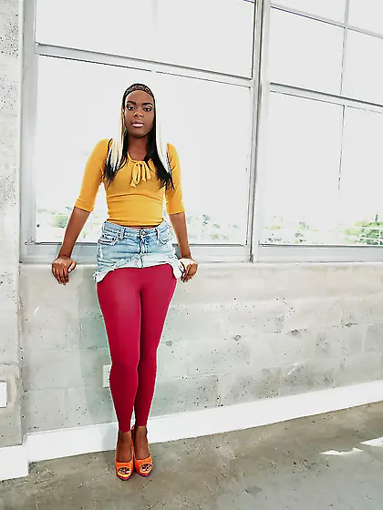 Lucy Raquel wears a wig and tries to make you smile and horny