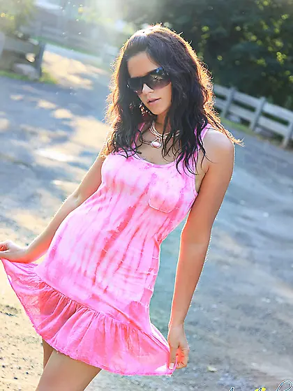 Ann Angel takes her cute pink dress before the caemra and shows