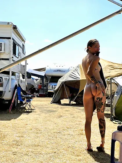 Tatted Up Nudist In A Camp