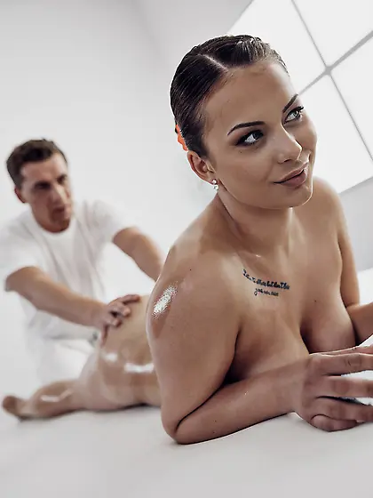 Busty brunette Mia Rose gets oiled up and pleasantly fucked on t