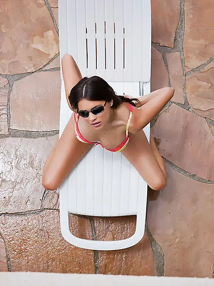 Topless bimbo Nina James gets spied when sun tanning in red biki