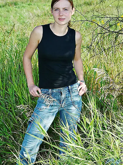 Naughty teenage babe Beth Nubiles strips by the car in the middl