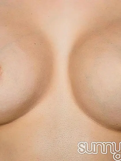 Kinky brunette Sunny Leone busts out her big breasts and twists