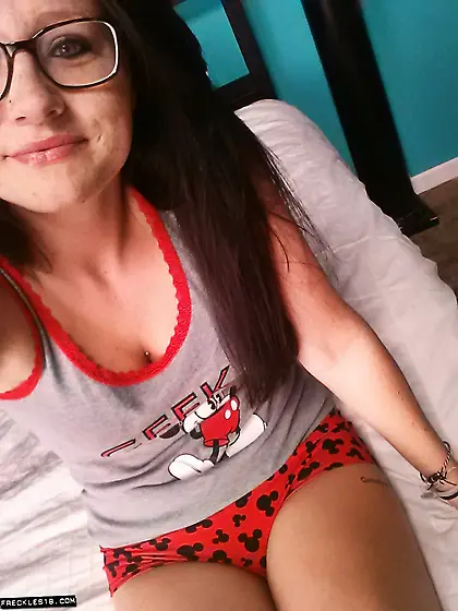 Busty dark haired Freckles poses and shows her boobs for the cam