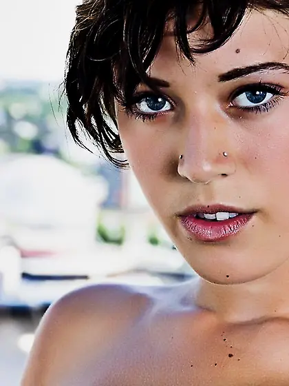 Sexy brunette teen Lexus Afterlife demonstrating tattoo on the n