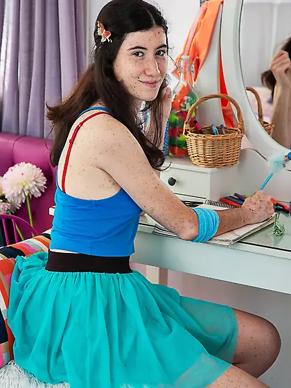 Girl in a sexy skirt looks adorable and kind of smug as well