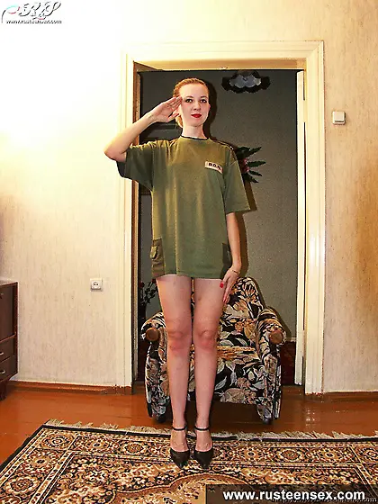 Russian teen blonde posing naked in a doorway