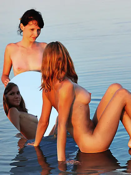 Sexy Lidiya A and Olga K use a mirror to enjoy every inch of the