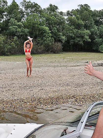 Sultry gadget in red bikini is in the boat riding the rock hard