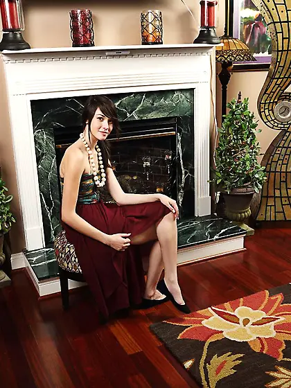 Hot brunette girl Emily Grey is sitting face to camera beading s