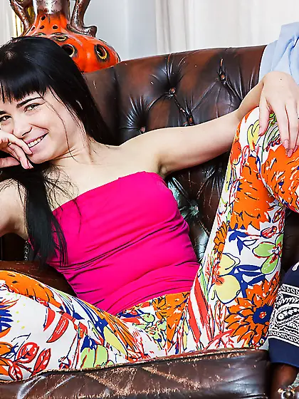 Dark-haired girl is full of joy and spreads legs to show hairy p