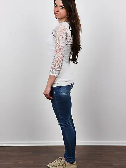 Smiling chick with big eyes and tiny breasts removes clothes so