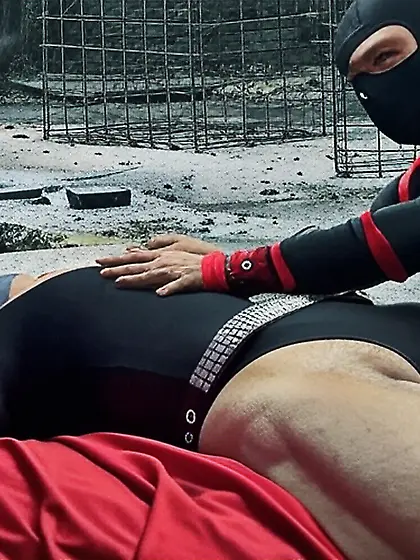 Black Superhero captured in netting.  KO and fondle