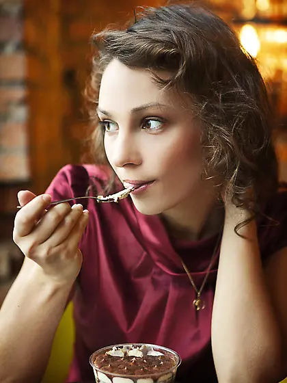 Curly-haired teen shows her incredibly hairy pussy after eating