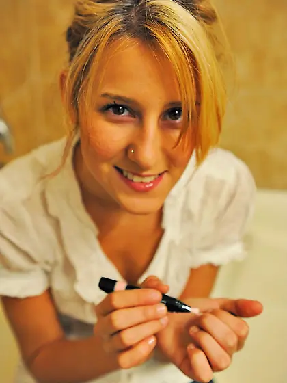 Sexy dressed teen Tina FTV in mini skirt pulls her panties aside