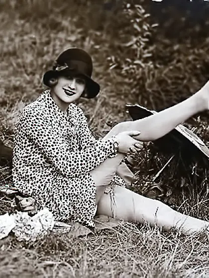 Petite beauty poses seductively