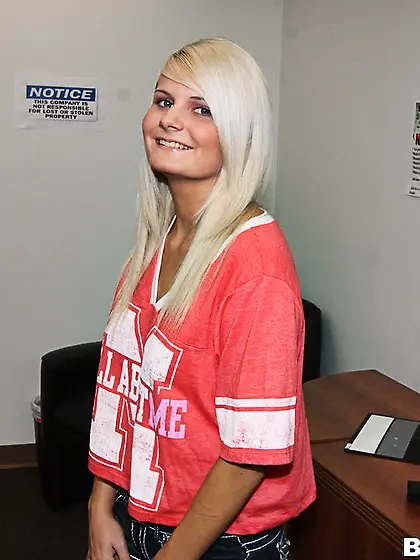 Sporty blondie caresses a big dick with her talented hands until