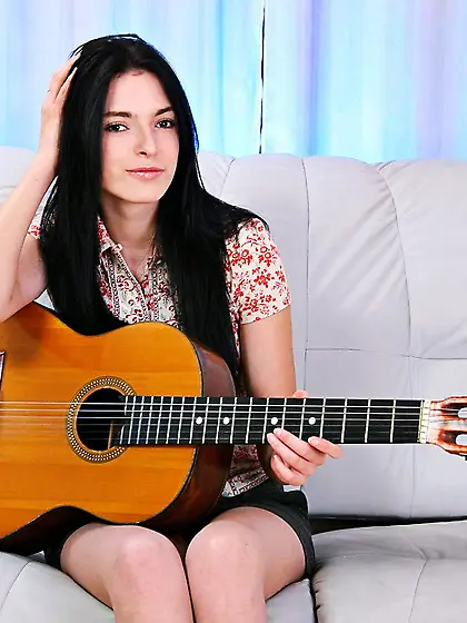 Sweet brunette in socks Larisa Nubiles plays the guitar and toys