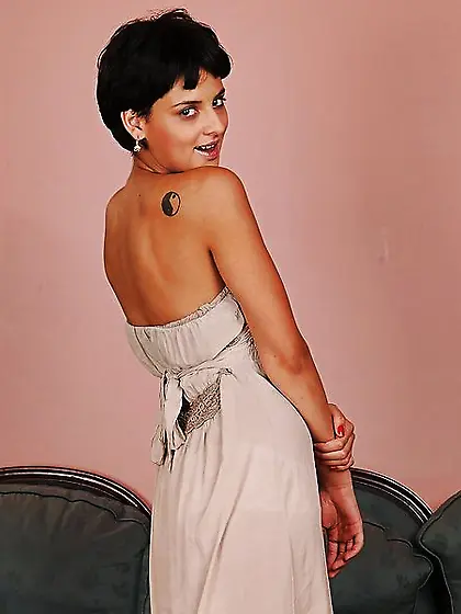 Enticing short-haired wench doffs long dress and teases with her