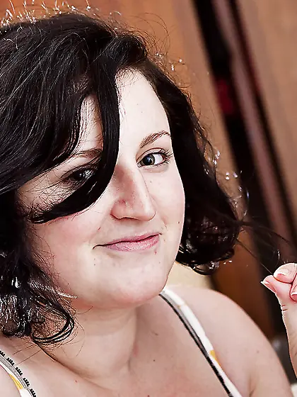 Brunette with natural boobs teasing you and looking real hot