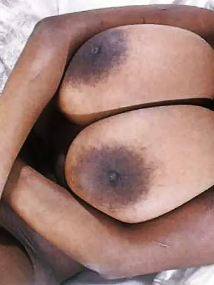 Dark woman has a set of highly huge breasts