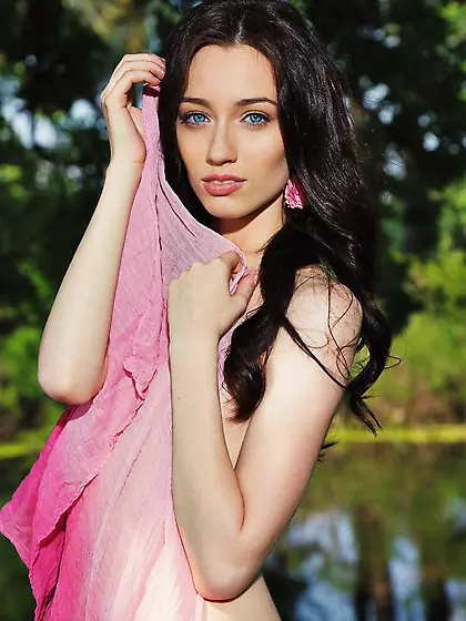 Lecherous brunette Zsanett Tormay poses outdoors with her tits a