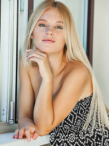 Blue-eyed blonde shows her pussy and more in a cute wicker chair