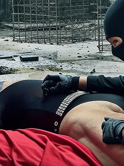 Black Superhero captured in netting.  KO and fondle