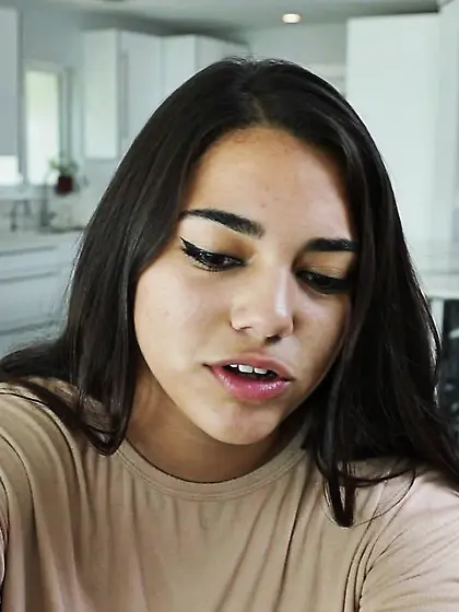 Long-haired slim brunette housemaid