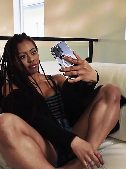 Kira Noir warms up with a glass dildo before anal