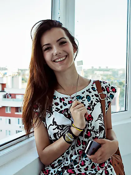 Curly-haired teen shows her tender pussy after a fresh cup of co