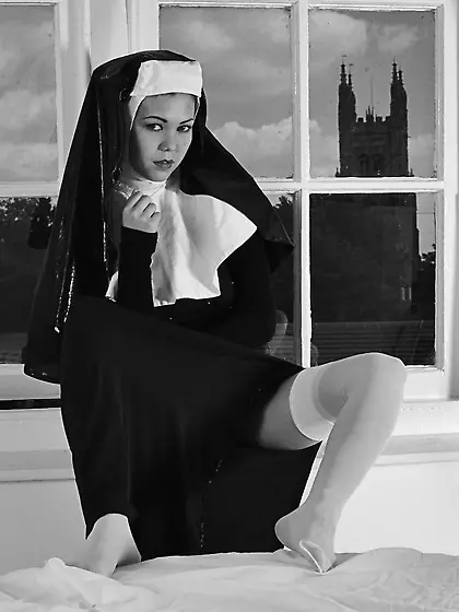 Shameless nun reveals tits while spreading legs to masturbate he