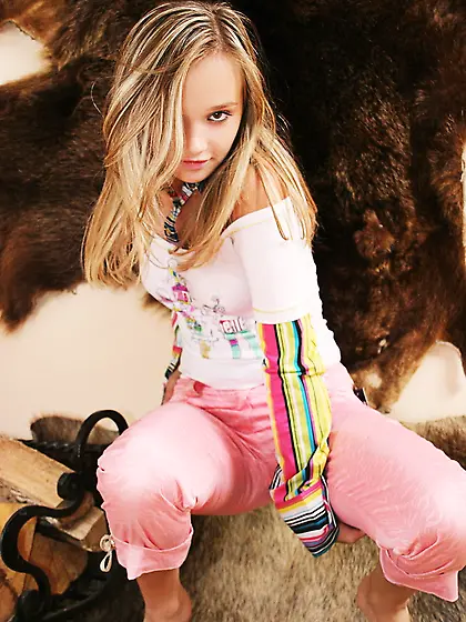 Cute and attractive blonde teen Kristina Fey takes off her pink