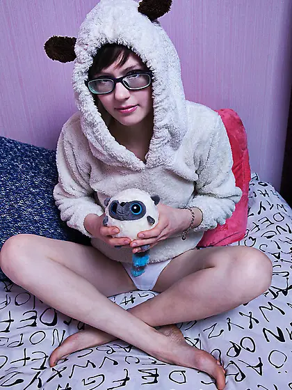 Short-haired bookworm seductively removes pajamas to show her sw