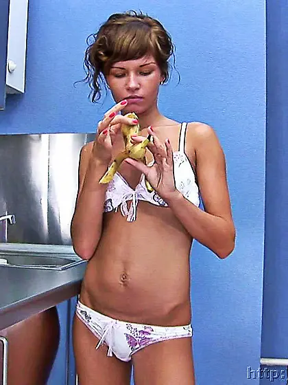 Teen brunette toying in kitchen