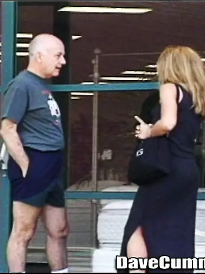 Black dress wavy-haired blonde