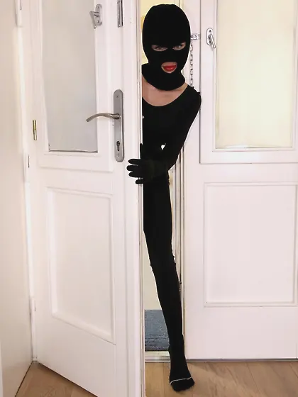 Catsuit-wearing brunette bimbo thief gets caught and fucked on a