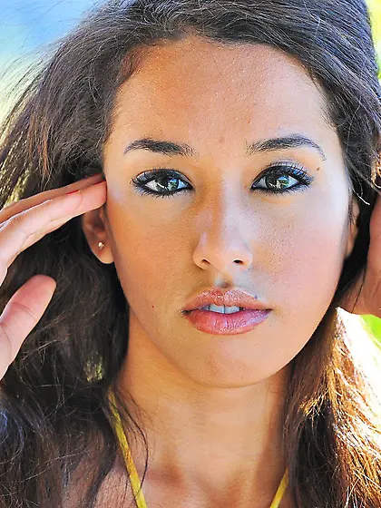 Cheerful Latin babe doing bridges and showing her half-naked bod