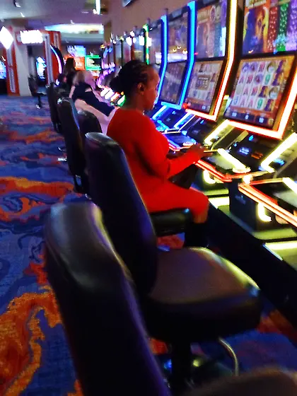Red dress juicy GILF with phat ass at the casino.