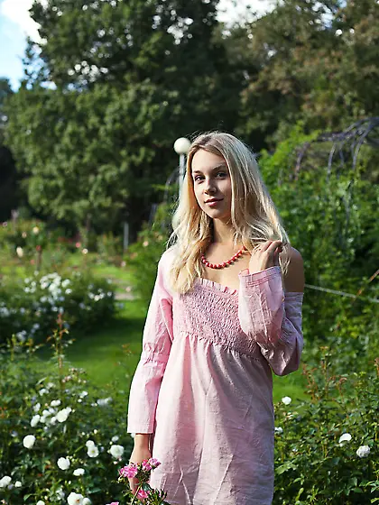 Perfect sunny weather motivates blonde to undress right in publi