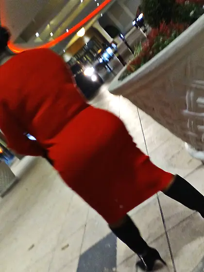 Red dress juicy GILF with phat ass at the casino.
