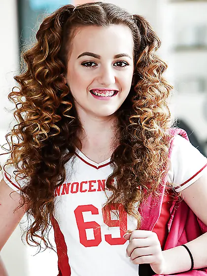 Horny cheerleader demonstrates twat that she didn't shaved for a