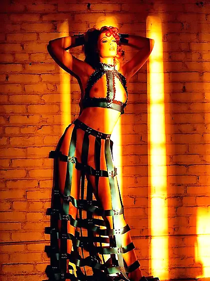 Redhead Justine Joli in amazing dress made of leather belts pose