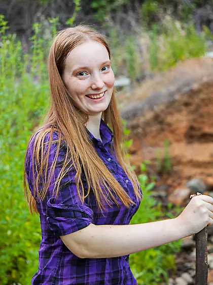 Red-haired country girl strips to flaunt her big breasts in the